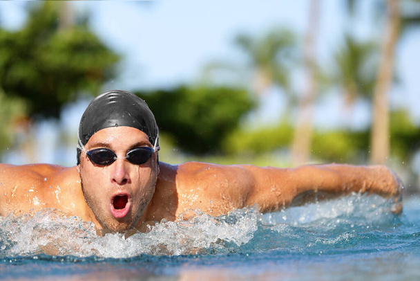 Swim man swimmer athlete swimming butterfly stroke - Φωτογραφία, εικόνα