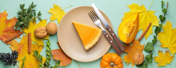 Autumn composition with tasty pumpkin pie on color background - Photo, Image