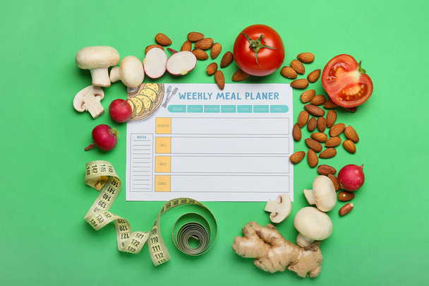Meal plan, healthy products and measuring tape on green background - Photo, Image