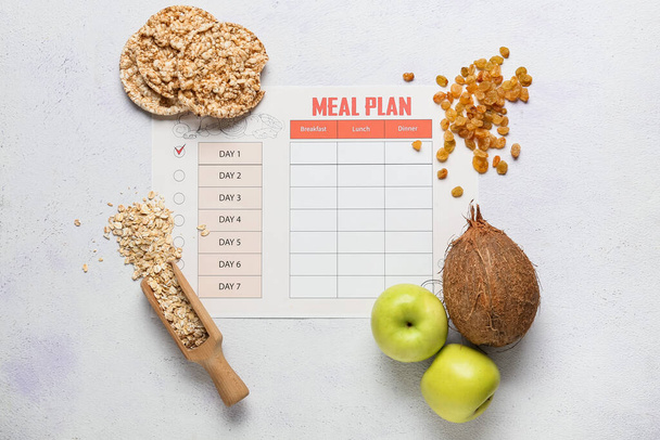 Healthy products with meal plan on light background - Photo, Image