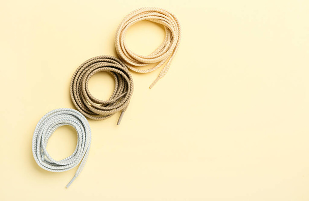 Rolls of different shoe laces on color background - Photo, Image
