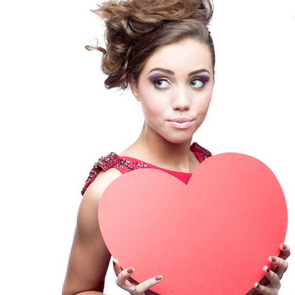 young cheerful woman holding red paper heart - Foto, Imagen