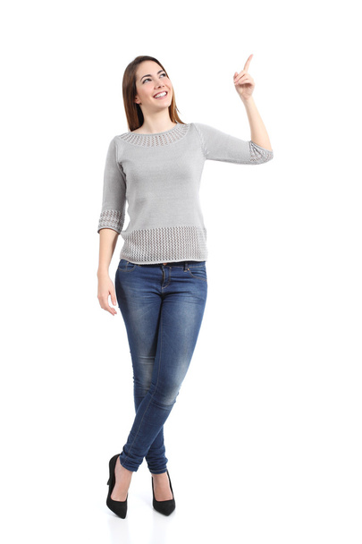Full body of a standing casual woman pointing at side - Foto, Imagem