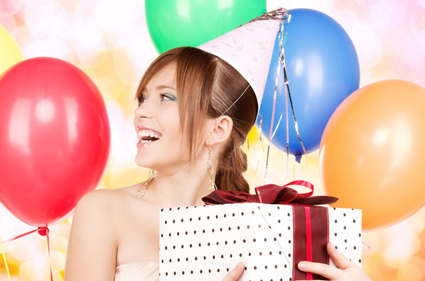 party girl with balloons and gift box - 写真・画像