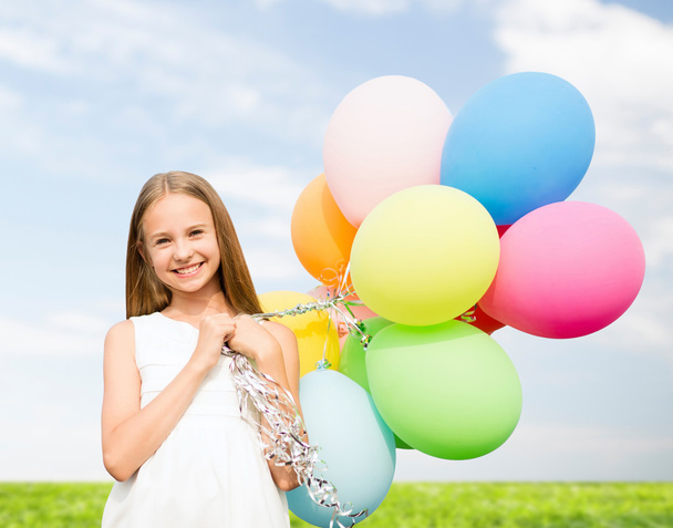 Fille heureuse avec des ballons colorés
 - Photo, image