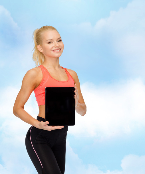 smiling woman showing tablet pc blank screen - Фото, изображение