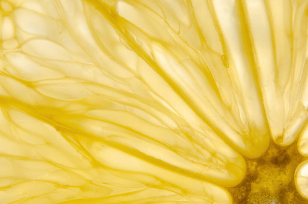 macro photo of slice of lemon. Abstract nature background - Photo, Image