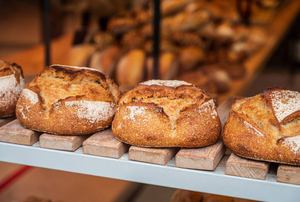 French bakery with fresh baked breads and buns close up - Photo, Image