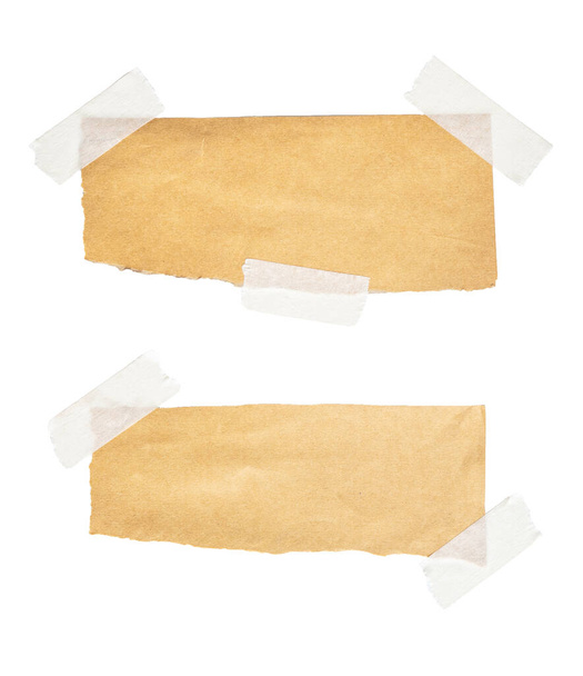 Brown paper labels attached with sticky tape on white background - Photo, Image