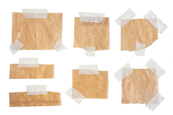 Brown paper labels attached set with sticky tape on white background - Photo, Image