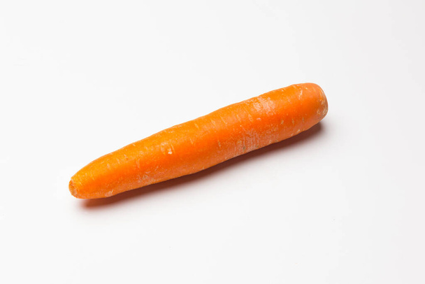 Carrot on white background. Rich in vitamins - Photo, Image