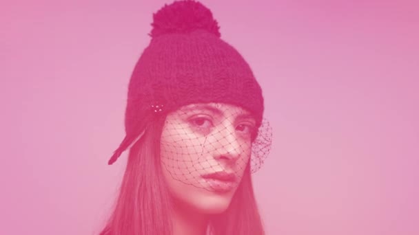 Woman posing and dancing in knitwear hat - Footage, Video