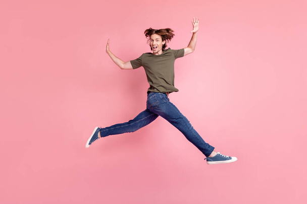 Full body profile side photo of young guy happy positive smile jumper go run isolated over pink color background - Fotografie, Obrázek