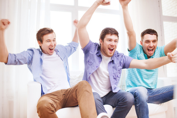 happy male friends at home - Фото, изображение