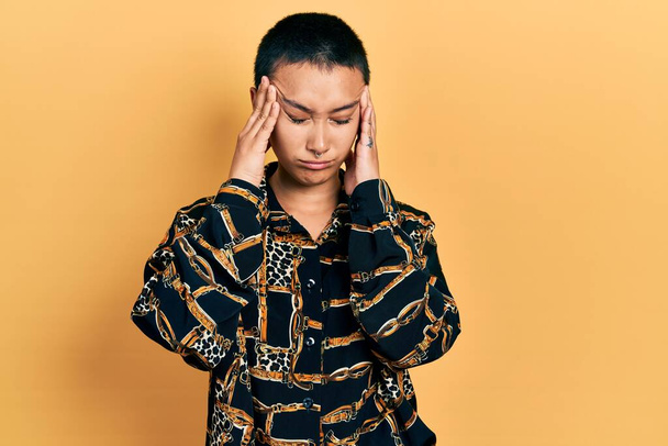 Beautiful hispanic woman with short hair wearing elegant shirt suffering from headache desperate and stressed because pain and migraine. hands on head.  - Photo, Image