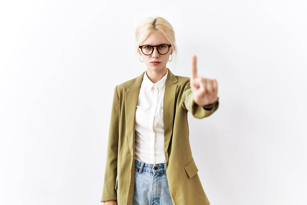 Beautiful caucasian business woman standing over isolated background pointing with finger up and angry expression, showing no gesture  - Photo, Image