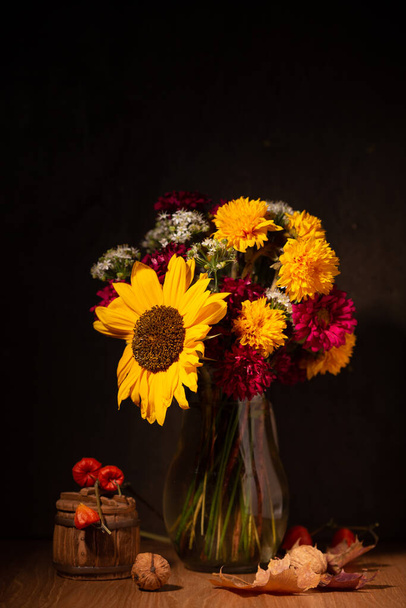 Classic still life with a bouquet of autumn flowers n a dark - Fotó, kép