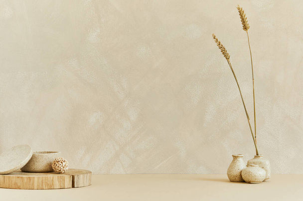 Minimalistic interior design with copy space, natural materials as wood and marbel, dry plants and personal accessories. Neutral beige colors, template. - Photo, Image