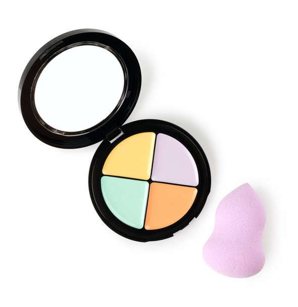 Palette of color correcting concealers with makeup sponge isolated on white background - Photo, Image