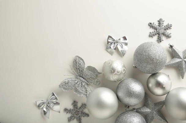 Silver christmas baubles decoration on white background. Top view - Photo, image