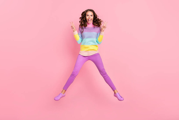 Full body photo of young lovely girl show fingers peace v-symbol jumper isolated over pastel color background - Fotó, kép