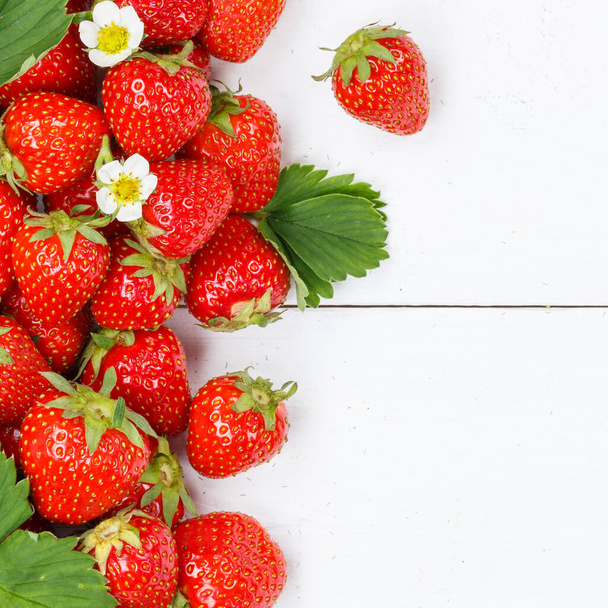 Strawberries berries fruits strawberry berry fruit with copyspace copy space on a wooden board square summer - Foto, immagini