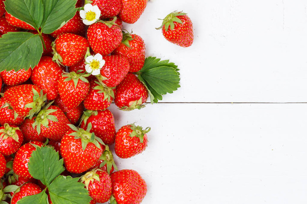 Strawberries berries fruits strawberry berry fruit with copyspace copy space on a wooden board summer - Foto, Bild