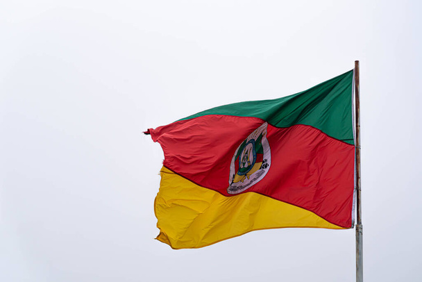 Flag of the State of Rio Grande do Sul in Brazil. Ragamuffin flag. Symbol of the gauchos. Flag of RS. Pennant hoisted in the wind. Tricolor pavilion. Civic symbol. Ragamuffin revolution. - Photo, Image