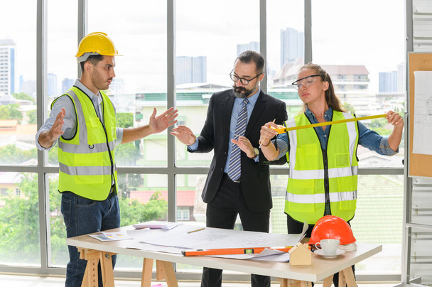 Engineers team meeting for architectural project. architects discussing blueprint with construction manager in office worker conference site. Construction Concept - Photo, Image