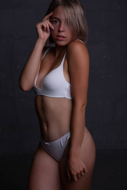 Young sexy blonde woman in underwear with a beautiful body - Fotografie, Obrázek