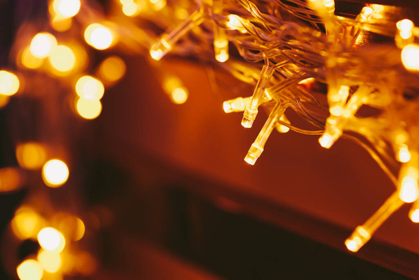 Bokeh light of holiday garland close up - Φωτογραφία, εικόνα