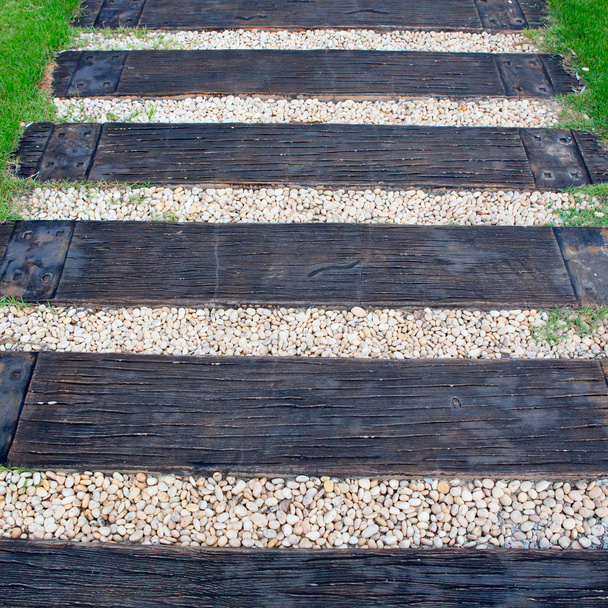 wood stair way on green garden - Foto, Imagem