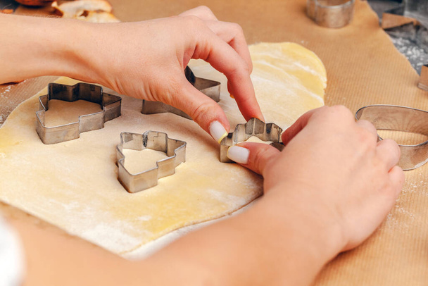 female hands making cookies from fresh dough at home - Φωτογραφία, εικόνα