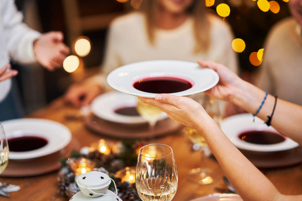 Friends celebrating christmas party holding wine - 写真・画像