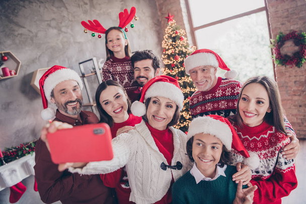Photo of little small preteen school wife husband retired pensioner married people xmas santa claus hat make selfie phone indoors - Photo, Image