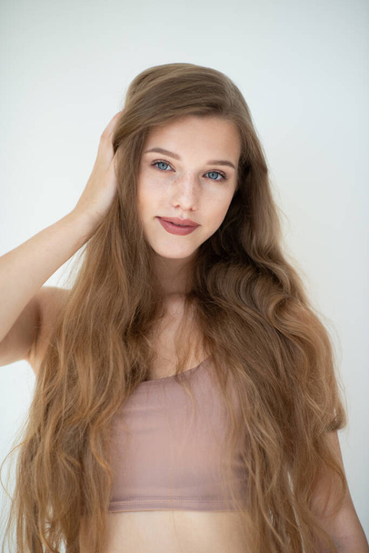 Portrait of a beautiful young woman with clean skin, beauty treatment, cosmetology and anti-aging theme - Valokuva, kuva