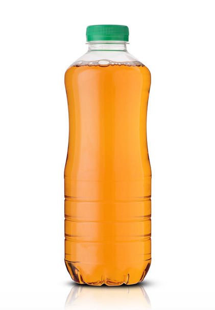 plastic bottle with orange juice on a white background - Фото, зображення
