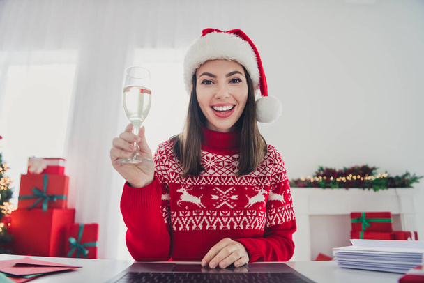 Photo of lovely lady look web camera make champagne toast wear santa hat sweater in decorated x-mas home indoors - Φωτογραφία, εικόνα