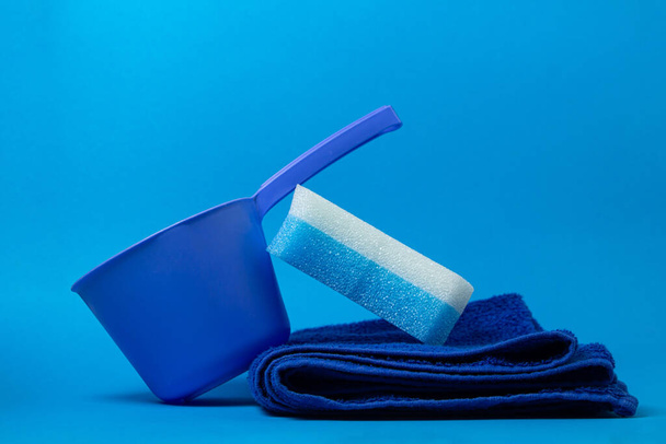 Bath accessories on a blue background. Blue bathing sponge - Photo, Image