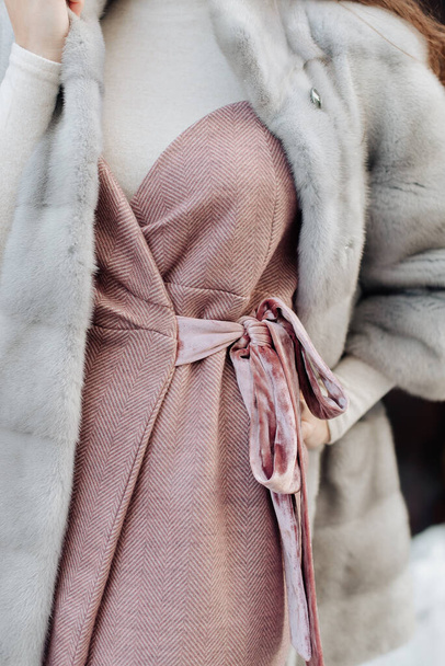 stylish dress and white fur coat on a girl close-up - Foto, immagini