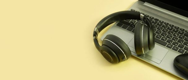 laptop, headphones on a colored background - Photo, Image