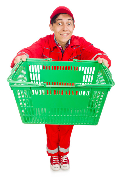 Homem em macacões vermelhos com carrinho de supermercado de compras carrinho - Foto, Imagem