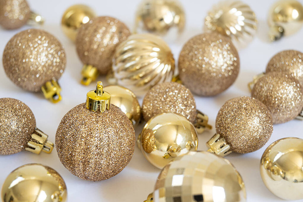 Full frame of golden christmas balls, christmas concept, select focus and copy space - Fotografie, Obrázek