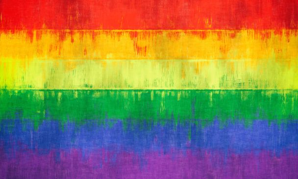 Fierté drapeau de couleur arc-en-ciel LGBT peint sur un fond de mur de pierre - Photo, image