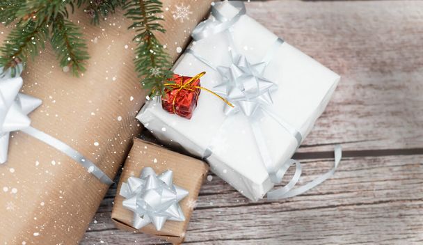 Christmas gifts on wood background. Green spruce - Фото, зображення