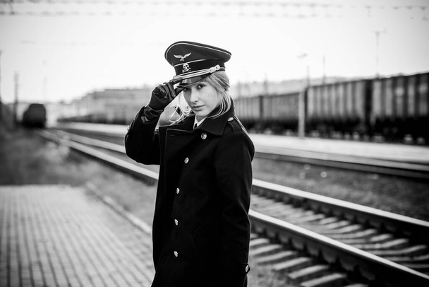 Woman in black military uniform, style. Cosplay of world war, gothic Lolita style, Halloween ideas - 写真・画像