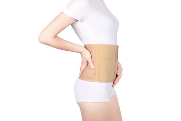  Back brace, waist support belt for back. Posture Corrector For Back Clavicle Spine. Post-operative Hernia Pregnant and Postnatal Lumbar brace after surgery. - Photo, Image