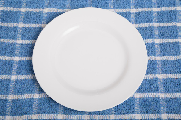 Empty Plate on Blue Towel - Foto, Imagen