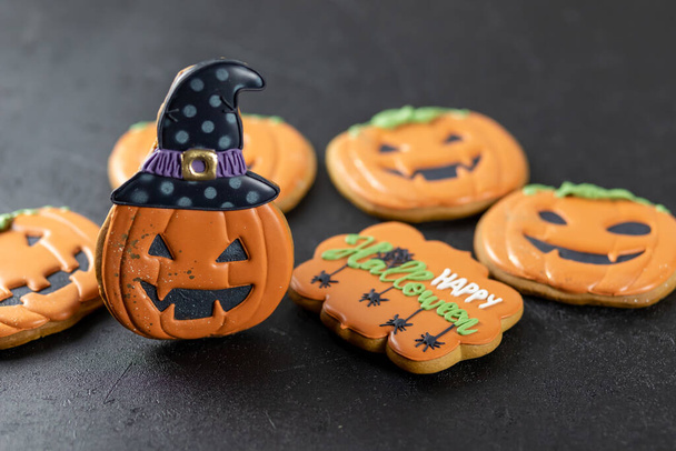 Bright Halloween gingerbread cookies on a black background - Foto, Imagem