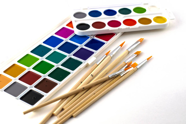watercolor paints and brushes on a white background. High quality photo - Photo, Image